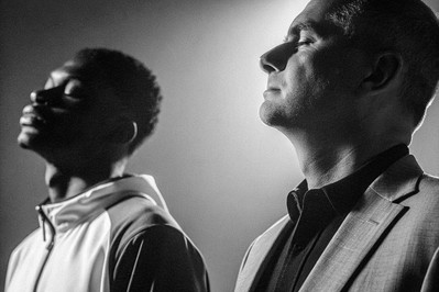 athlete and executive pausing eyes closed