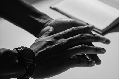 Athlete’s hands near a watch during box breathing