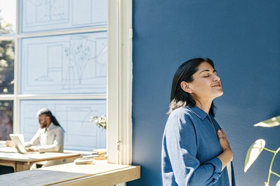 leader pausing with hand on heart