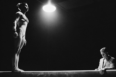 gymnast exhaling on balance beam