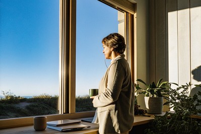 Leader pausing at a window at dawn