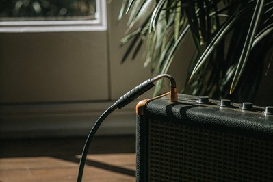 Guitar cable plugged into amplifier
