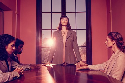 Leader pausing before speaking in a tense meeting