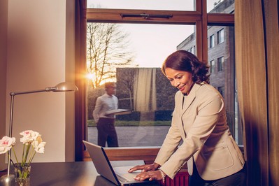 professional closing laptop at sunset