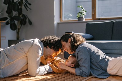 Parent and infant face-to-face with soft light