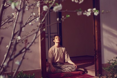 guest meditating in tranquil garden