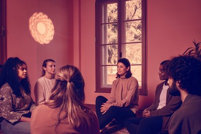 students and educators in circle dialogue