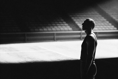 Athlete exhaling slowly before action with focused eyes