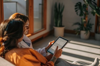 Clinician reviewing explainable AI dashboard with patient
